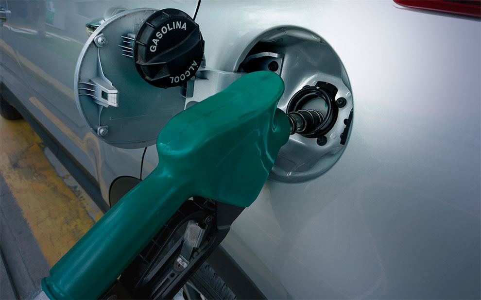 Green fuel pump filling up a car