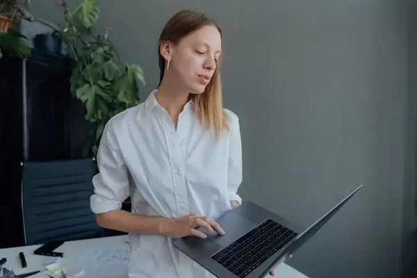 Woman holding laptop