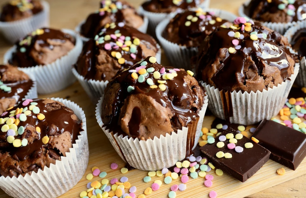 chocolate cupcakes with multicoloured sprinkles