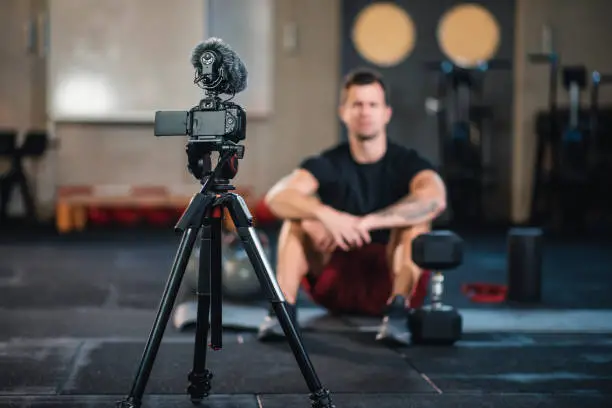 Gym trainer in front of camera