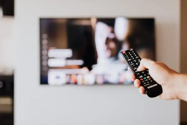 TV remote pointing towards TV