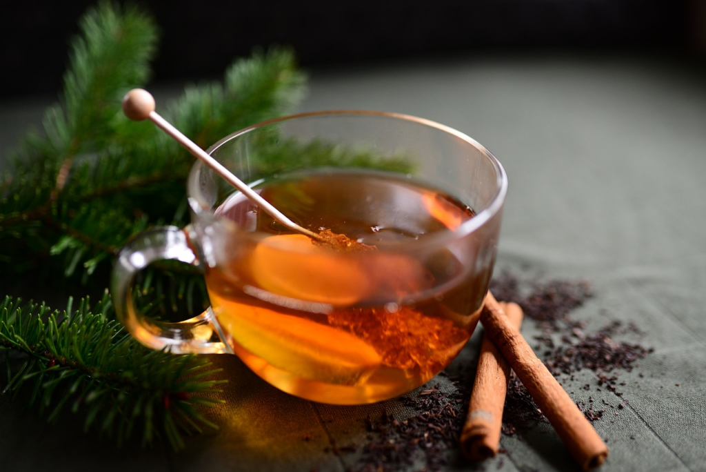 cinnamon tea with a honey stick
