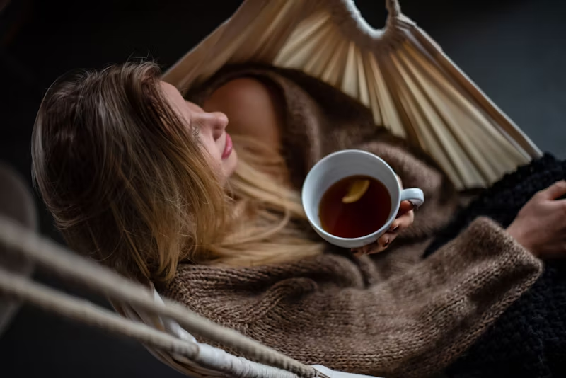 a relaxed woman drinking tea