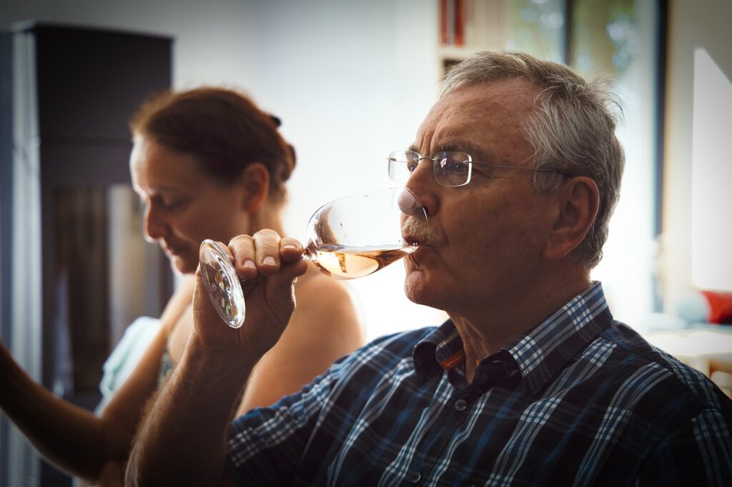 Senior drinking wine