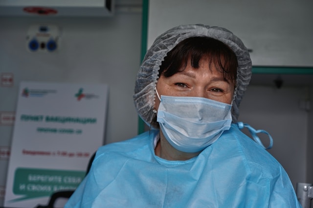 nurse assisting in surgery