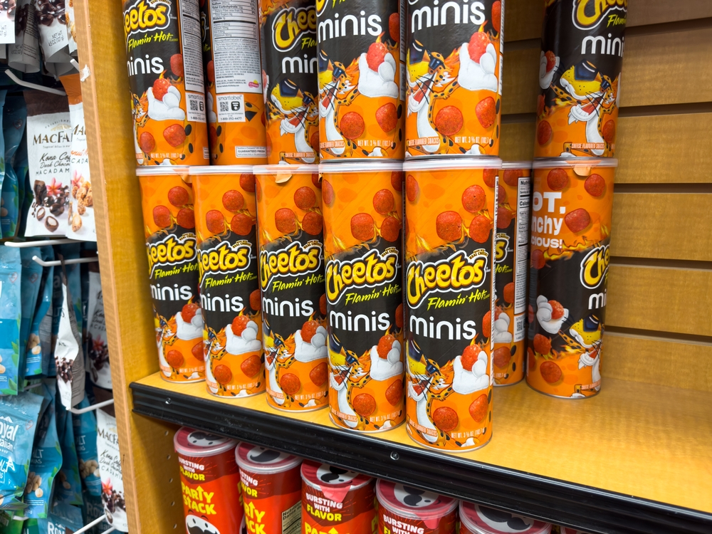 Los Angeles, California, United States - 02-01-2023: A view of several containers of Cheetos Flamin' Hot minis, on display at a local grocery store.