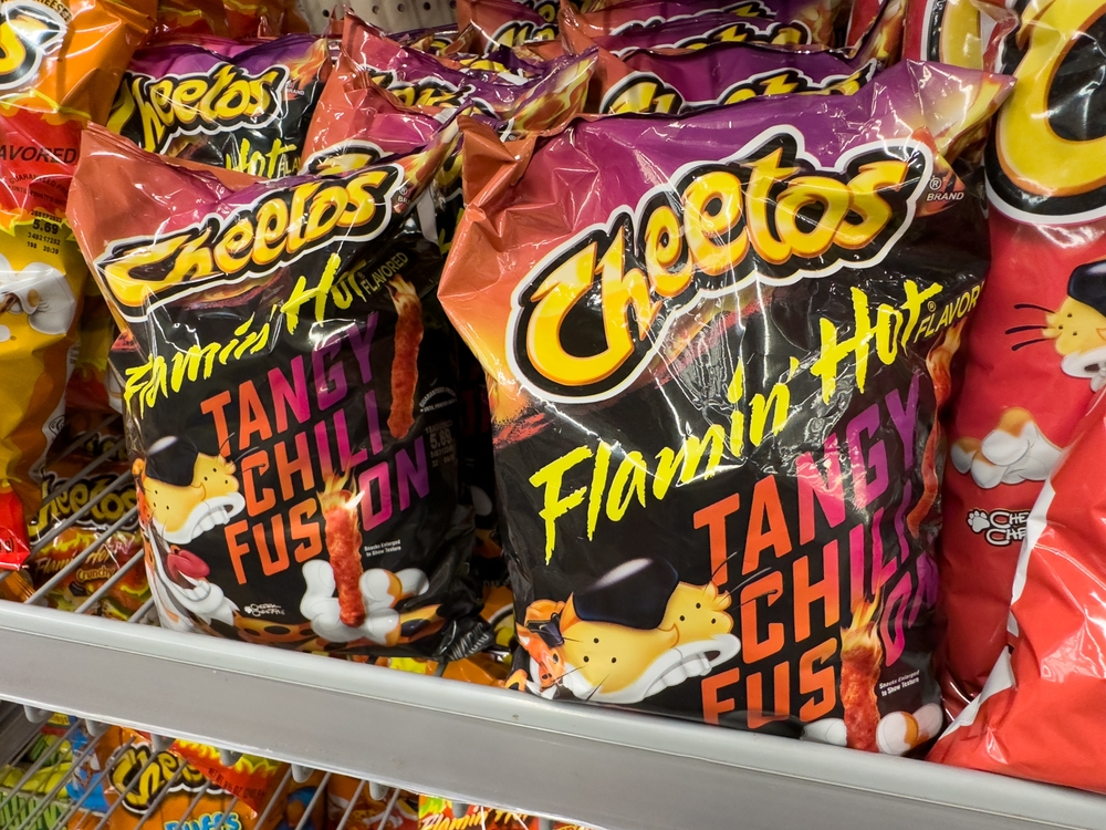 Los Angeles, CA - July 17, 2023: Bags of new flavor Cheetos Flamin Hot flavored corn chips.