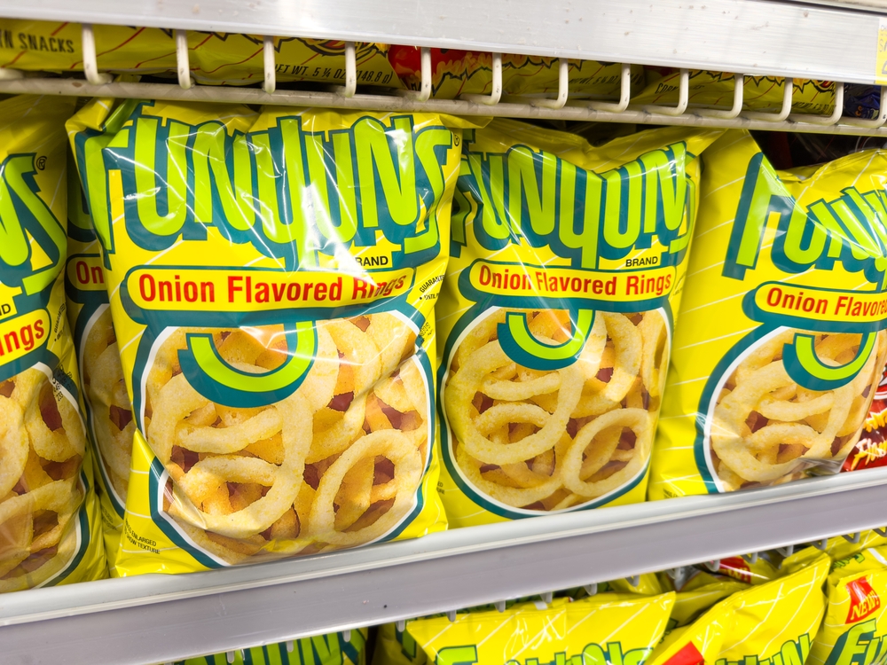 Los Angeles, CA - November 11, 2023: Large bags of Funyuns brand onion flavored rings on market shelf.