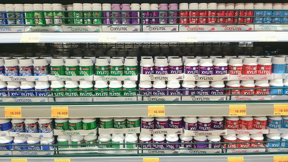 Chewing gum brand Xylitol. Stacked on a shelf in a supermarket to buy sell. Various flavors fresh mint bubblegum on display. Colorful pack. Java, Indonesia - February 5, 2023