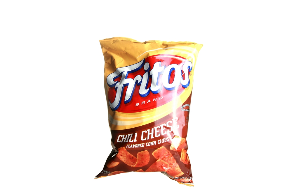 Lake Forest, California - USA - February 26-2024: Frito's Chili Cheese Flavor Corn Chips. Mexican Food Flavor. Frito Lay's Corn Chips. Isolated on white. Room for text. Bag of Chips. Snack Food. Lunch