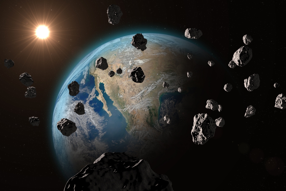 Asteroids near planet Earth. Asteroids or meteorites heading for Earth planet, outer space view. End of the world concept. Elements of this video furnished by NASA.