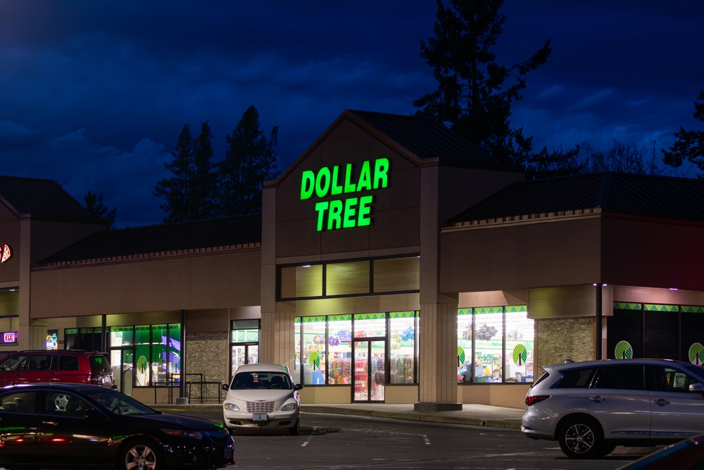 Beaverton, OR, USA - April 2, 2024 - Beautiful bright green illuminated Dollar Tree (Dollar store) sign on the Dollar Tree store building, captured at stormy night