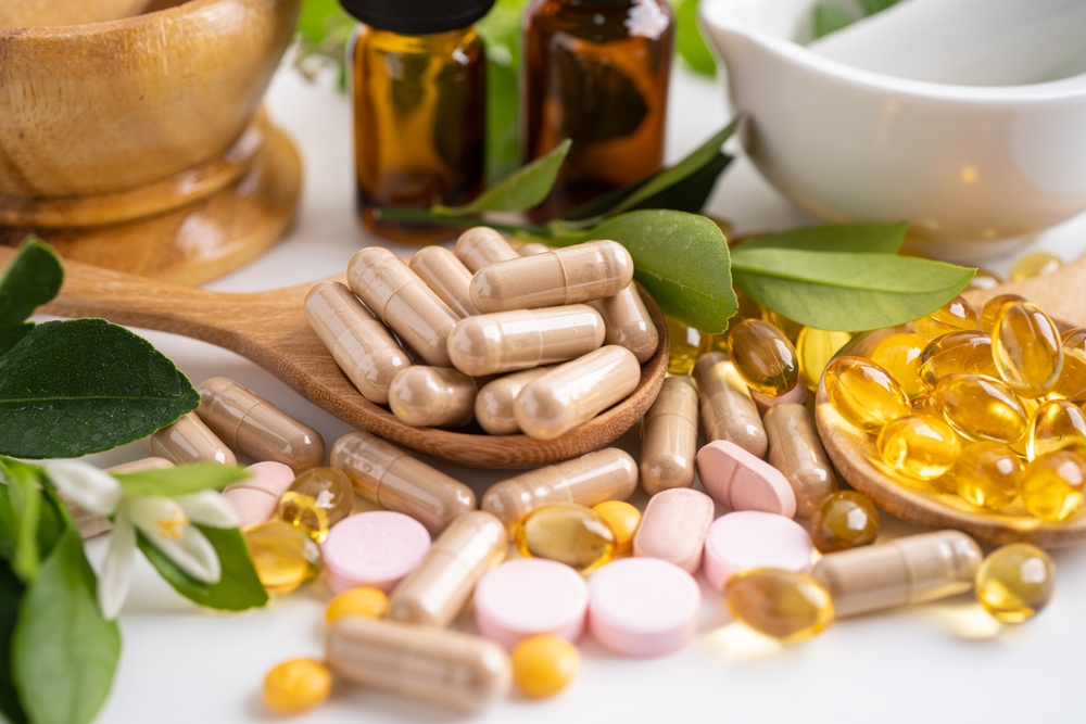 Alternative medicine herbal organic capsule with vitamin E omega 3 fish oil, mineral, drug with herbs leaf natural supplements for healthy good life.