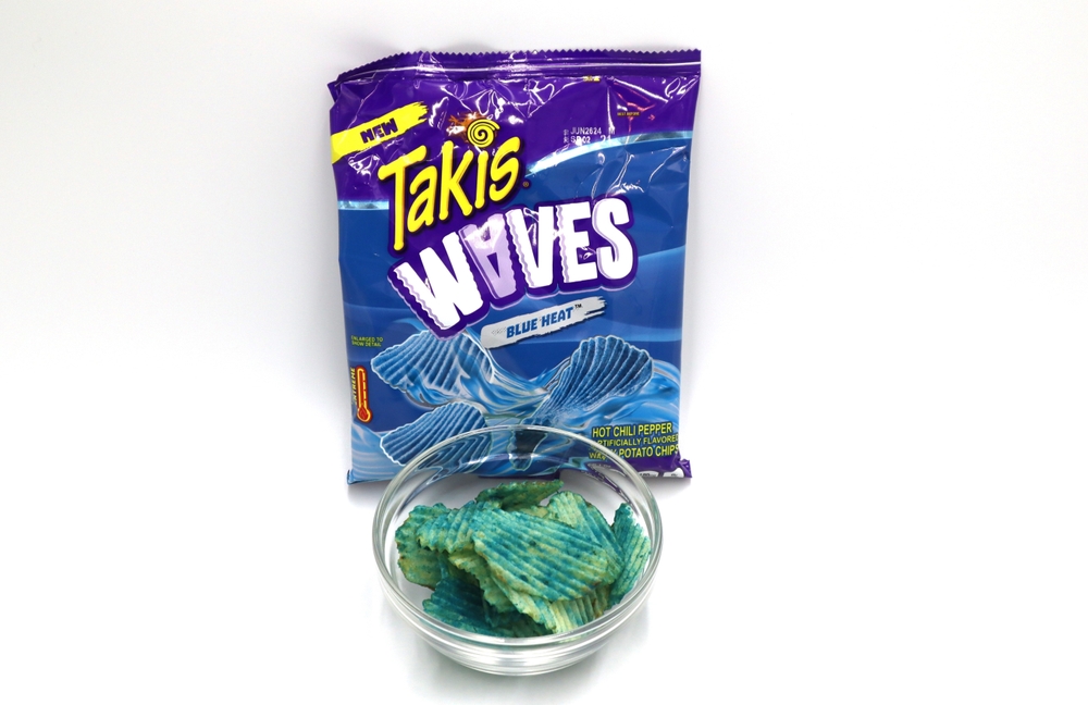Norway 3 july 2024: New Takis Blue Heat Hot Chili Pepper Waves chips hot spicy chips crisps snacks on white background
