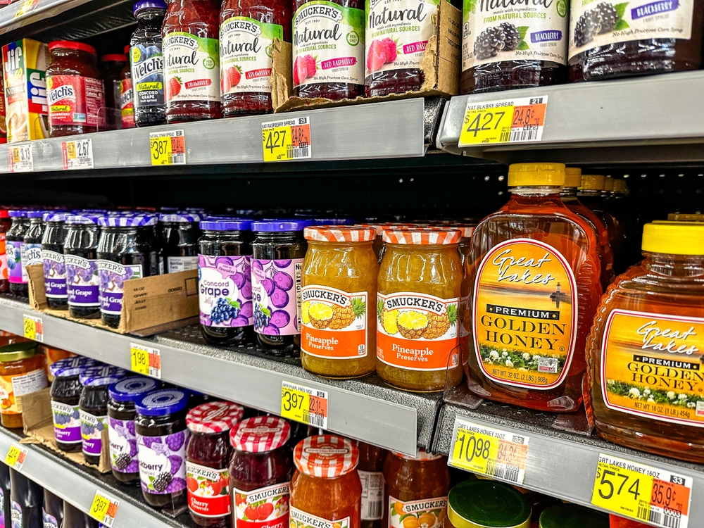 Valparaiso, IN, USA - September 13, 2024: Jars of jams, jellies and honey on a store shelf