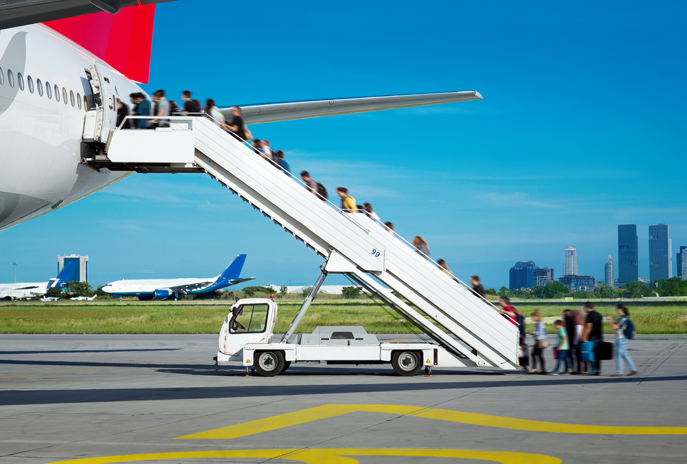 People boarding from apron