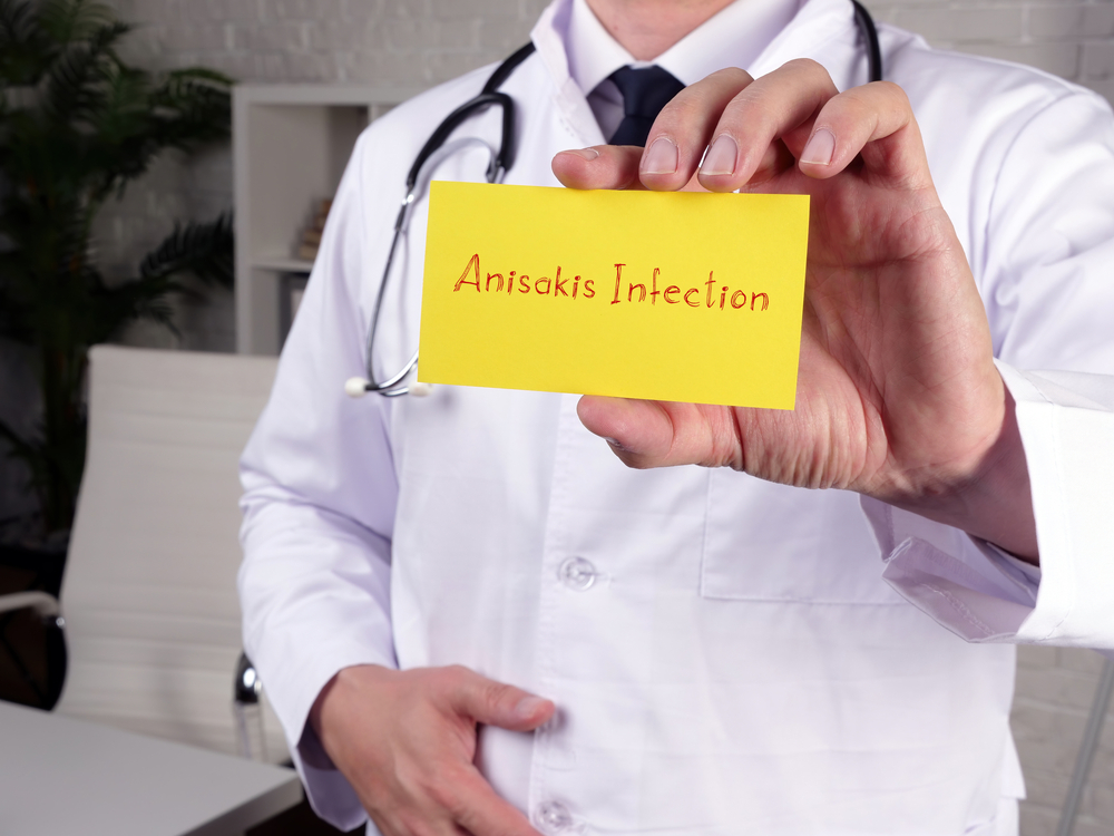 Medical concept meaning Anisakis Infection with inscription on the sheet.
