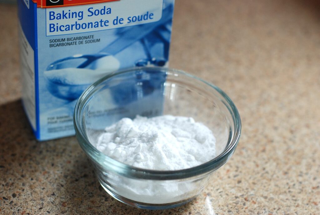 Baking soda. Countertop in the background.