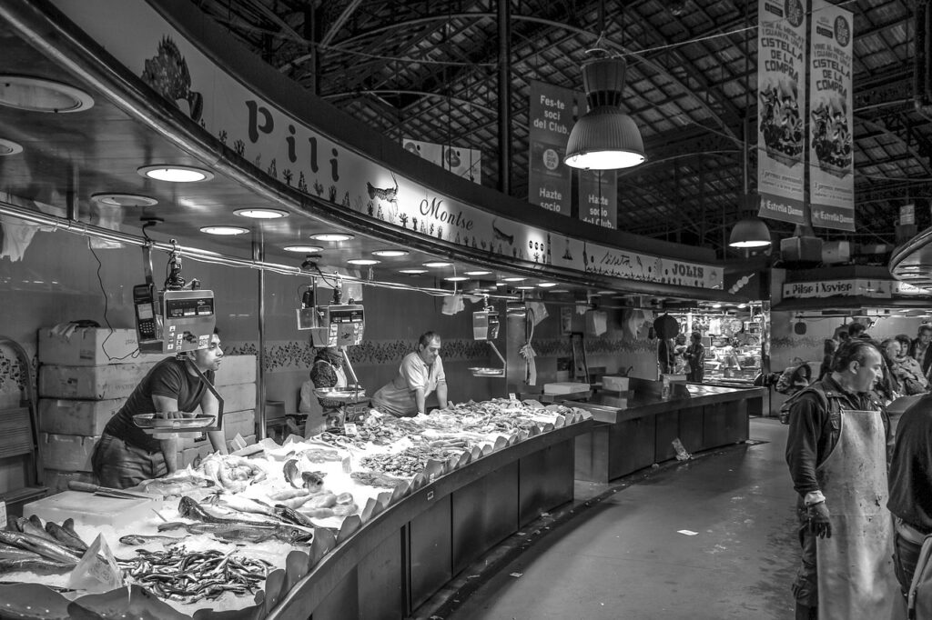 A black and white image of a seafood market.