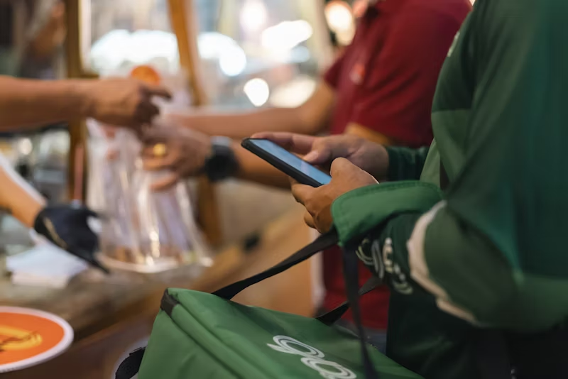 person waiting in line at groery store