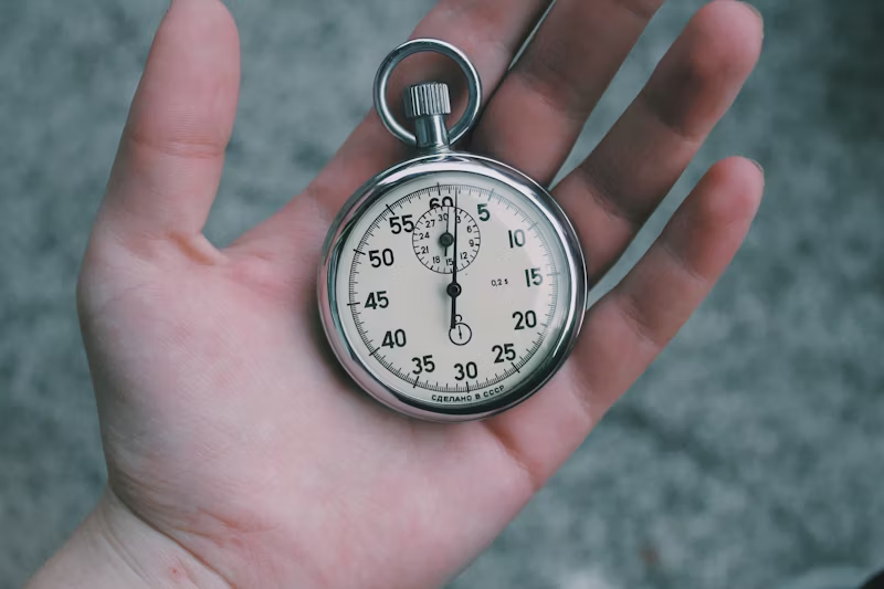 A stopwatch sitting in someone's hand