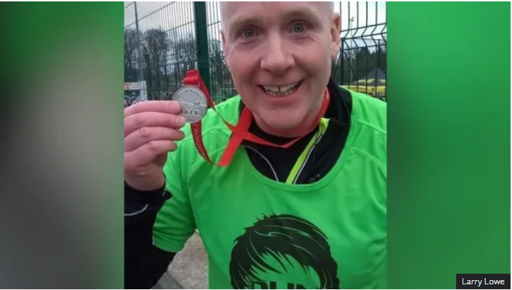 Larry with running medal