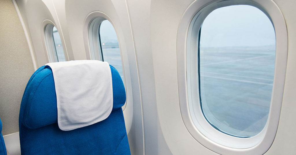 What Do Those Triangle Stickers Above Your Airplane Seat Mean?