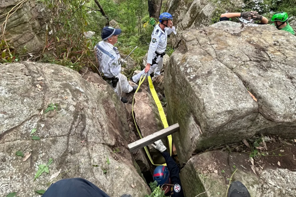 The woman was wedged between rocks near an overgrown bush track. 