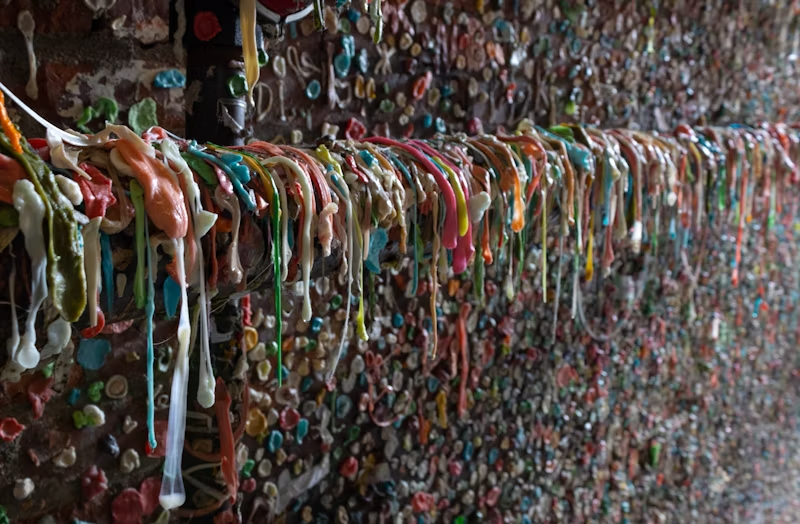 a wall covered in used chewing gum