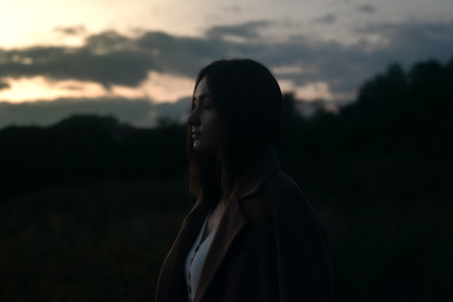 woman in a brown coat