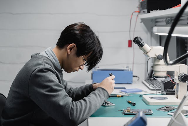 man working at desk making nuclear battery