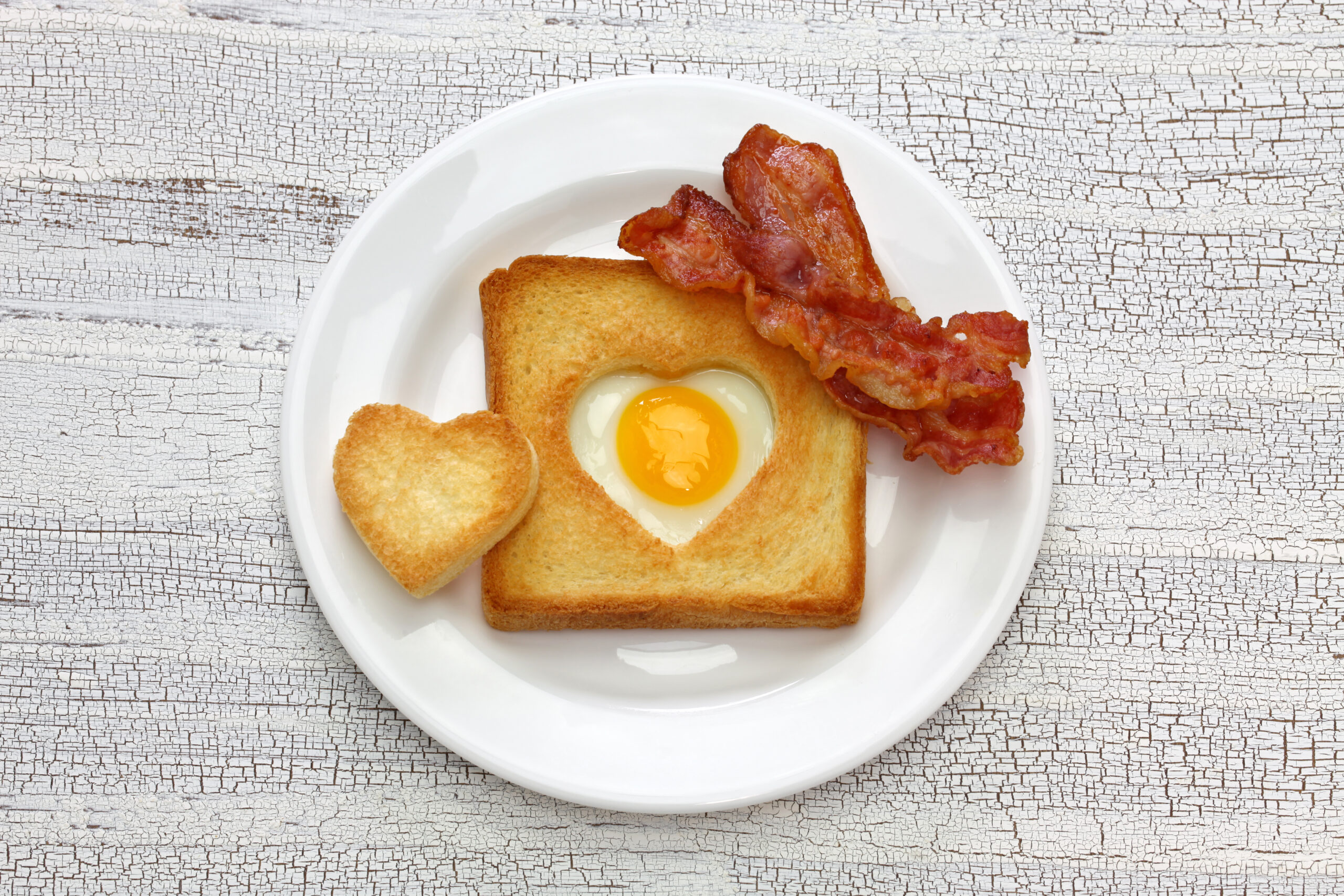 Egg in a hole of bread then toast that also known as egg in the basket.

