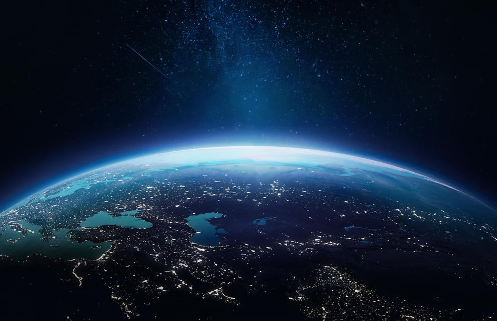 Surface of Earth planet in deep space. Outer dark space wallpaper. Night on planet with cities lights. View from orbit. Elements of this image furnished by NASA