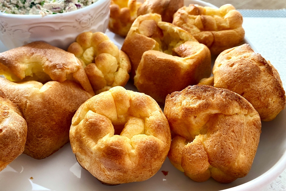 Popovers Fresh popover muffins are served on a white platter. Yorkshire pudding
