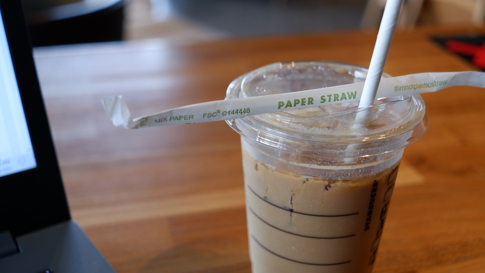 Paper straw in a cup of coffee. Starbuck, Serpong. 10 March 2022.