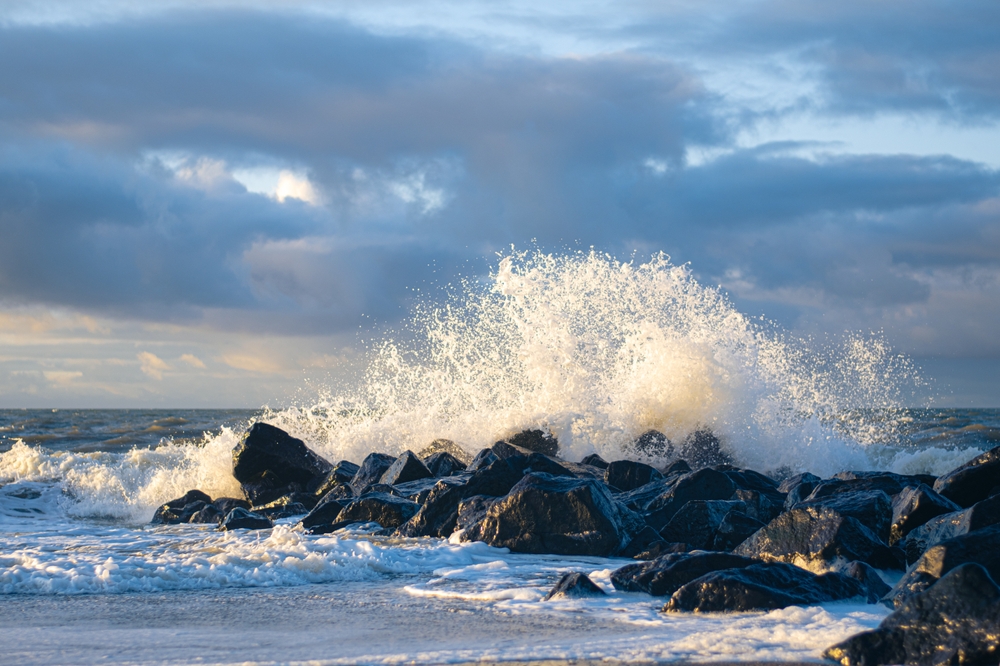 Wave crashing at rocks at danish coast. High quality photo