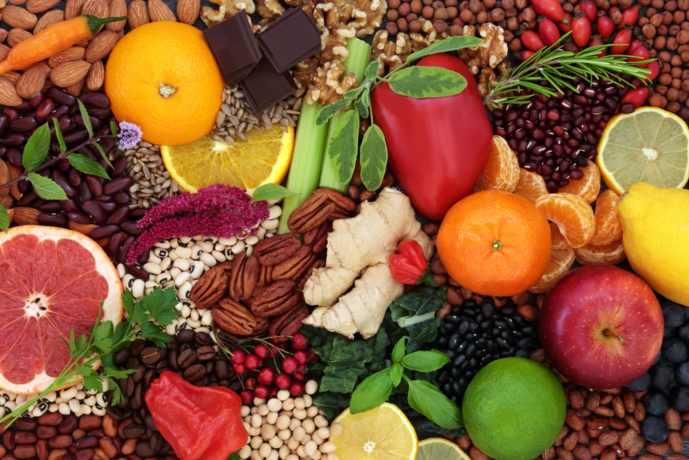 Vegan and vegetarian health food large collection high in bioflavonoids, antioxidants, flavonoids, lycopene, anthocyanins, vitamins, proteins, polyphenols, minerals, fibre. Flat lay.