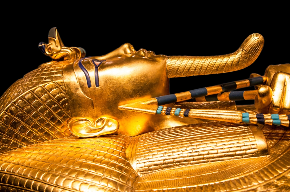 Tutankhamun's golden burial mask on black background. King Tut.