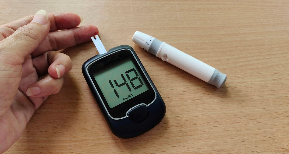 portrait the fingertip check of diabetes, showing high blood sugar on monitor, hyperglycemia patient woman take proactive control, concept health care.