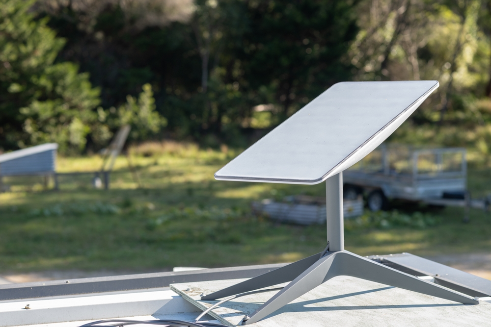 MORUYA, AUSTRALIA - MAY 16 2023: Starlink satellite dish installed on a house roof in rural Australia.
