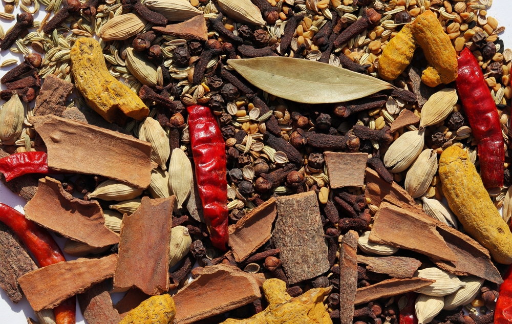 Top View of Condiment or Spices Like Cardamon, Cloves, Black Pepper, Turmeric, Dry Chilies, Cinnamon, Fenugreek Seed, Cumin, Fennel, Perfect for Background