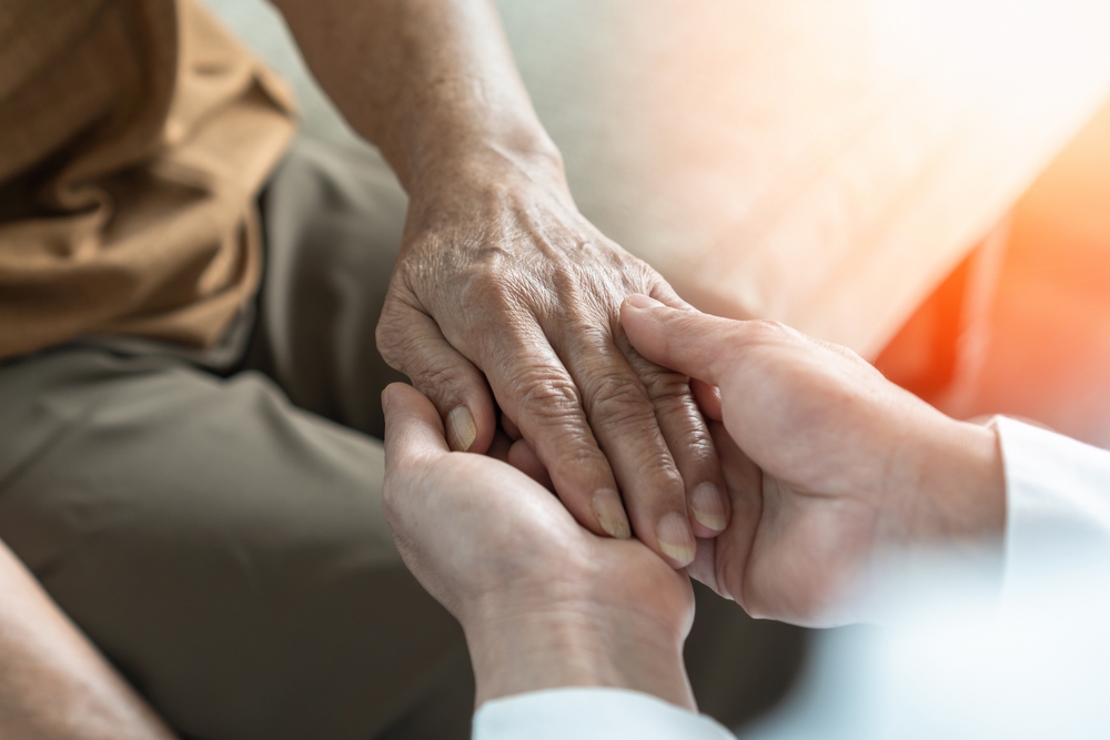 Parkinson disease patient, Alzheimer elderly senior, Arthritis person's hand in support of geriatric doctor or nursing caregiver, for disability awareness day, ageing society care service
