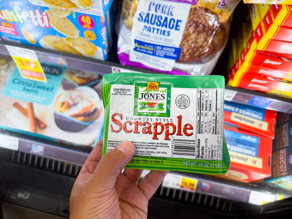 Los Angeles, California, United States - 08-16-2023: A view of a hand holding a package of Jones Dairy Farm scrapple, on display at a local grocery store.
