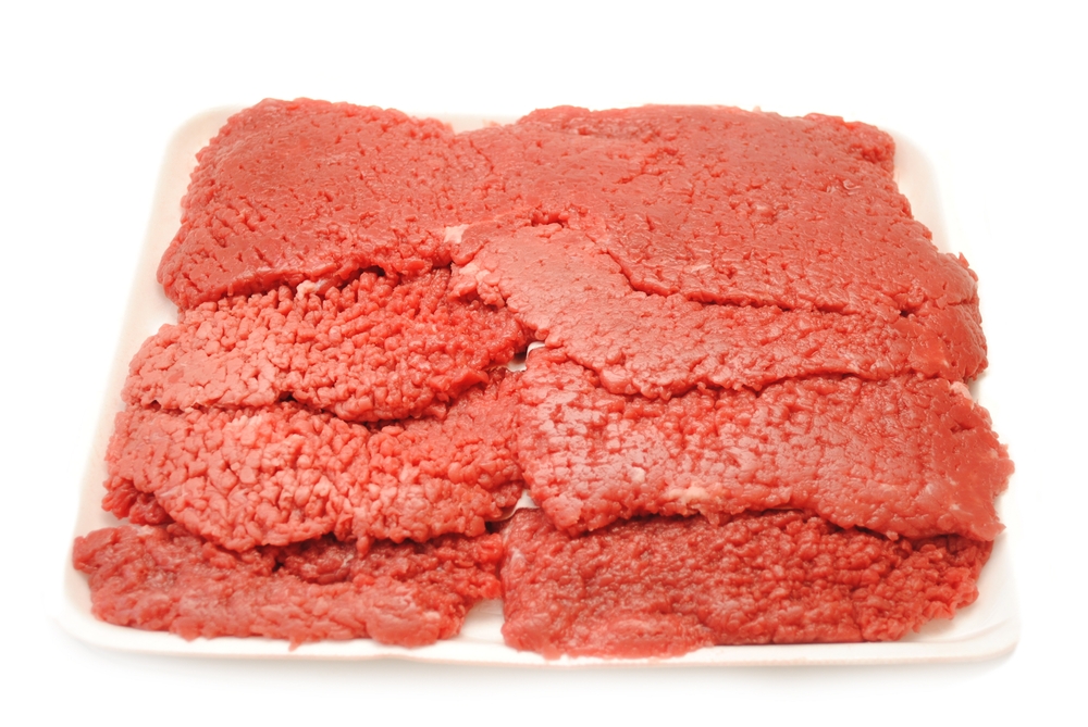 Raw Bloody Cube Steaks Piled