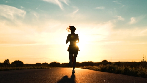 silhouette sports girl running legs along road sunset, after runner competition, mountain trail running, woman runs, warming up before training, fit athletic girl runs dawn, american woman running