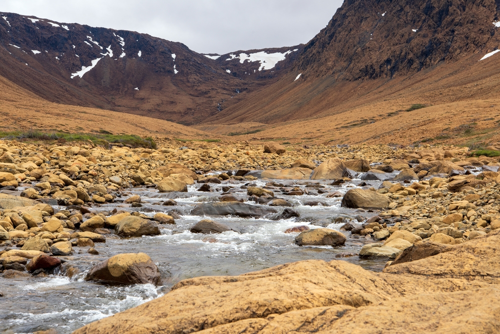 The Tablelands in the Gros Morne National Park are like a barren desert due to the peridotite rock that is thought to originate in the Earth's mantle.
