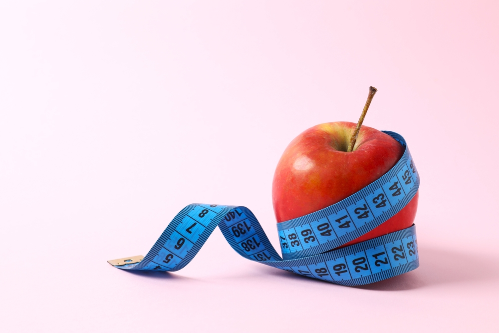 Diet and weight loss, healthy lifestyle, composition with measuring tape

