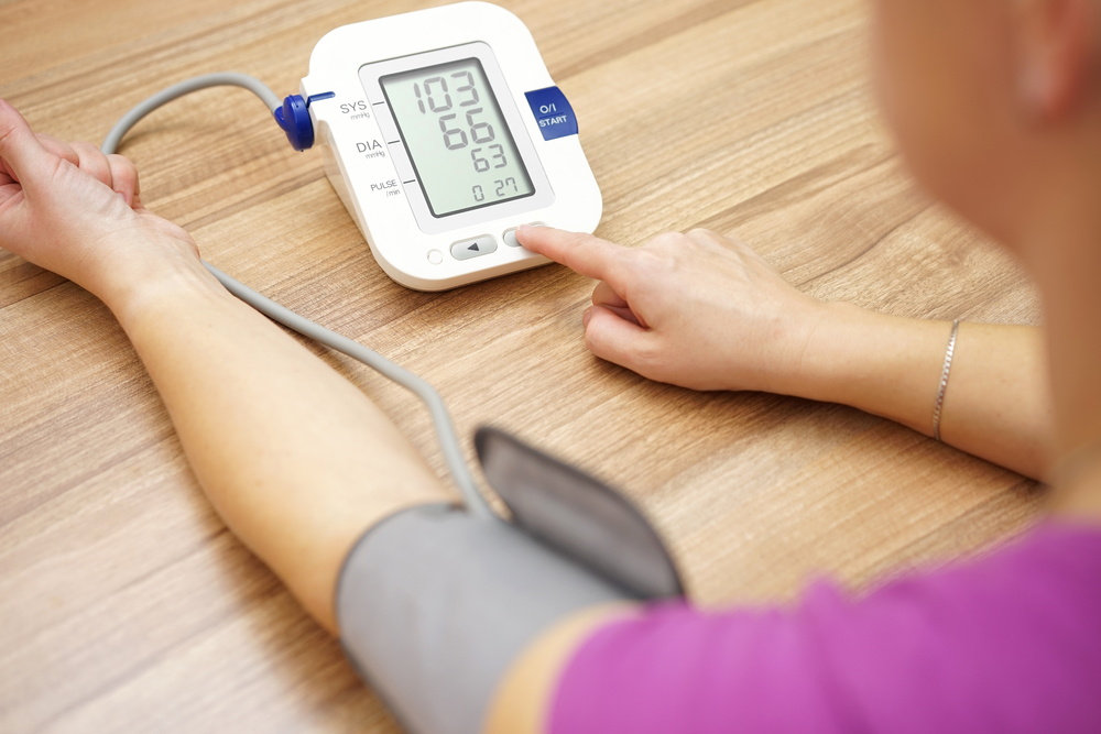 Woman is taking care for health with hearth beat monitor and blood pressure
