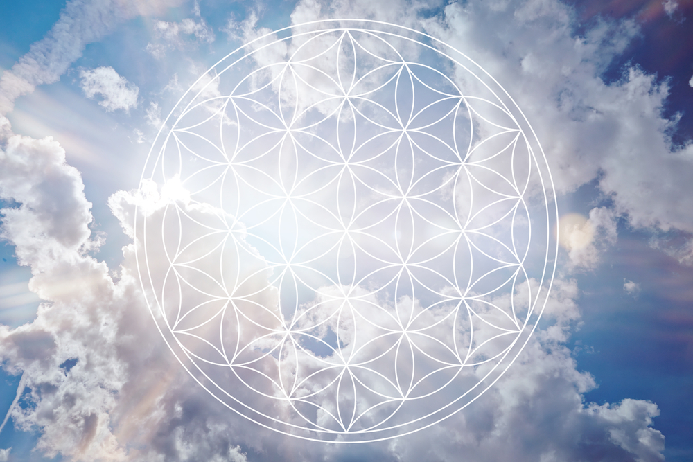 Flower of life in the sky as holistic reiki sign
