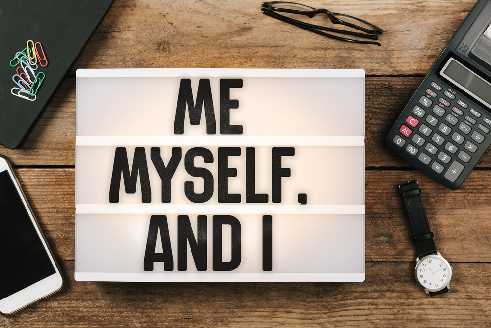 Me, myself and I in vintage style light box on office desktop, high angle birds eye view